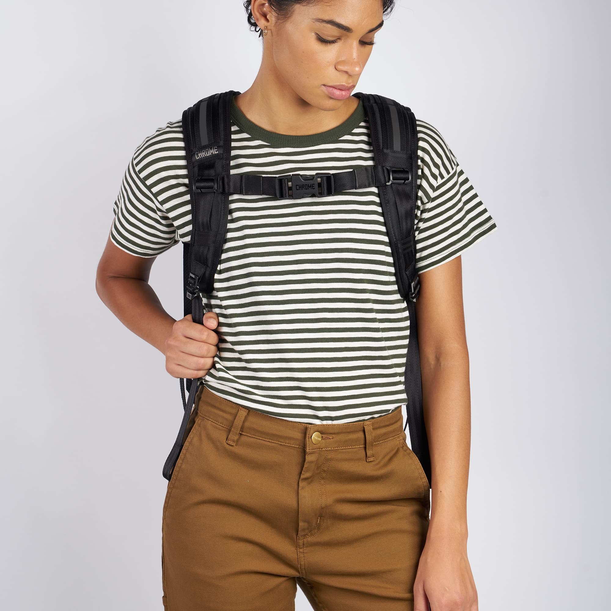 Waterproof 20L backpack in black worn by a woman front view