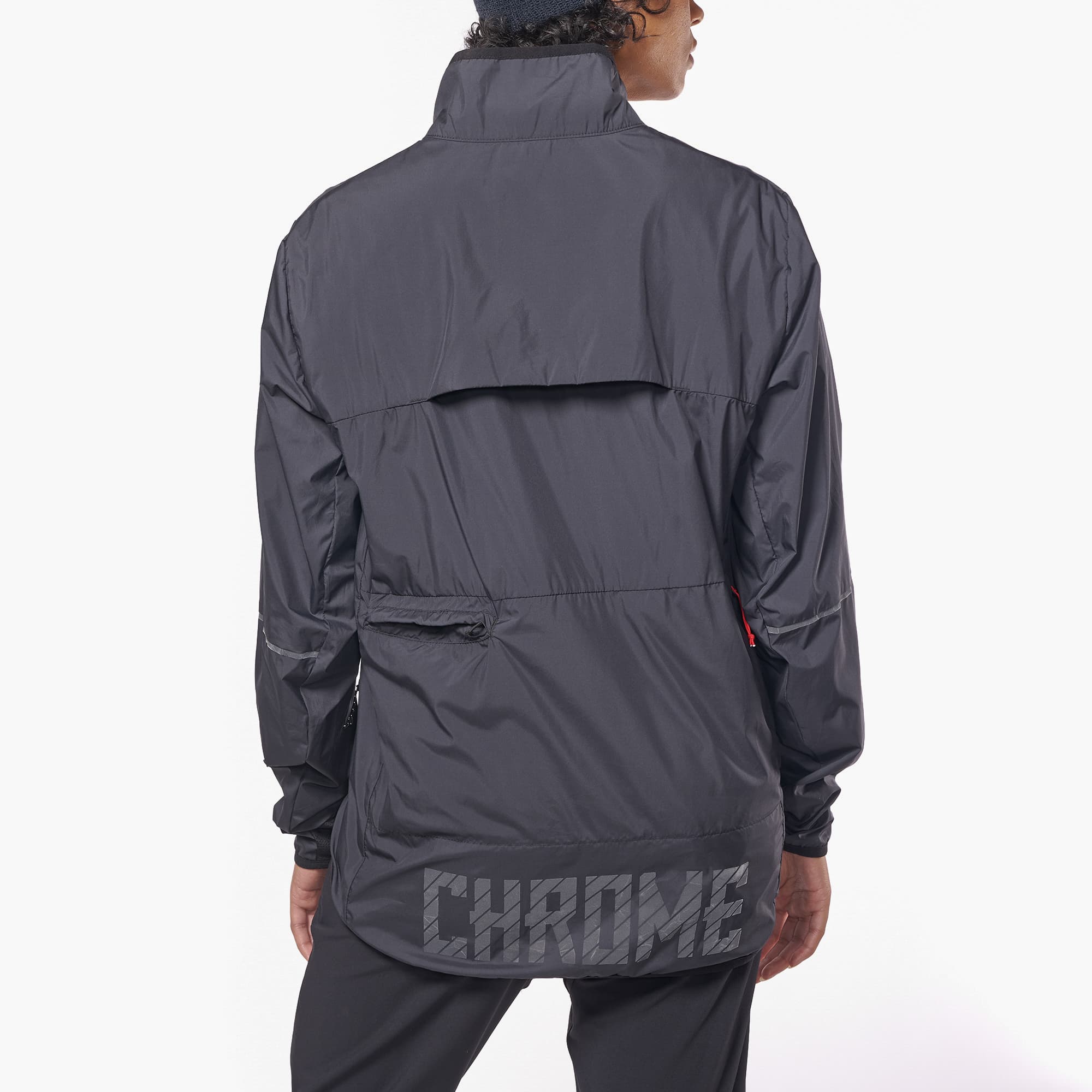 Lightweight packable wind breaker in black shown on a woman back view