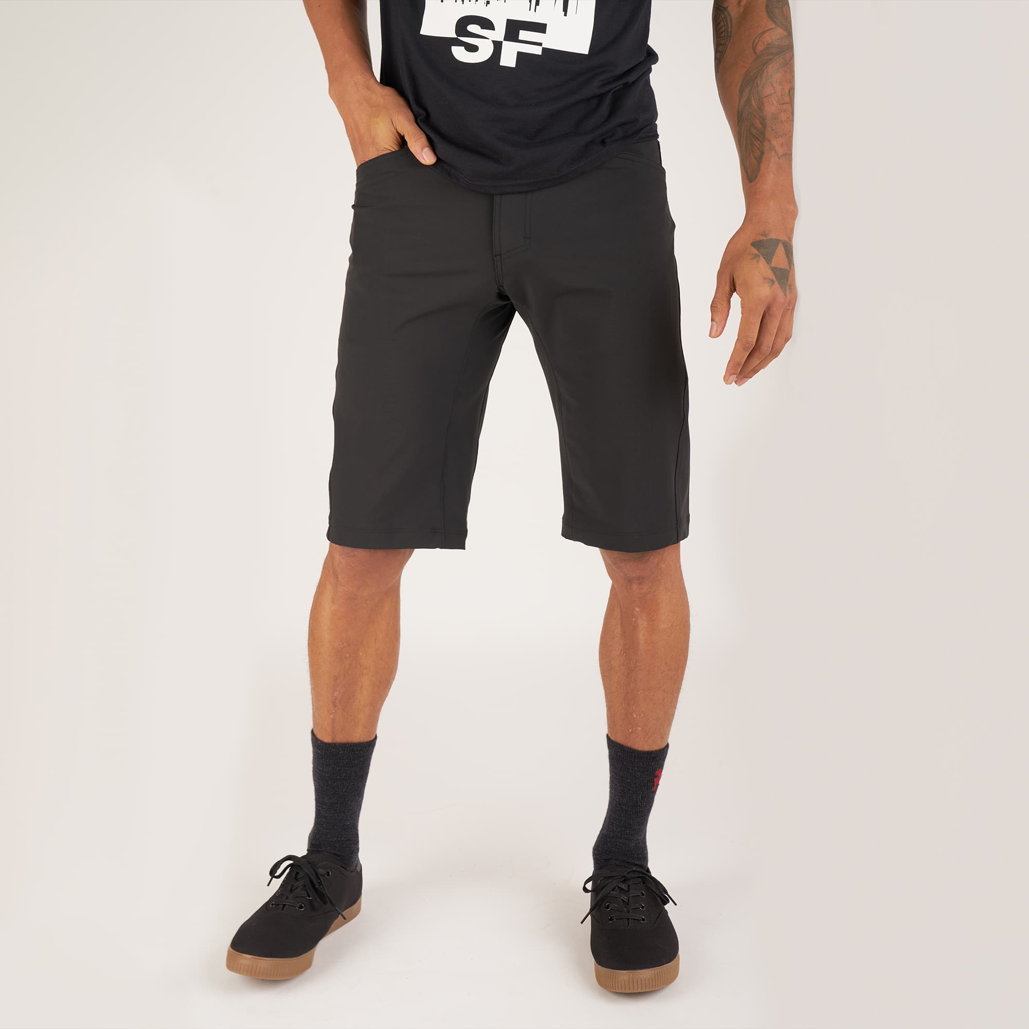 Men's Union Short 14" inseam in black worn by a man #color_black