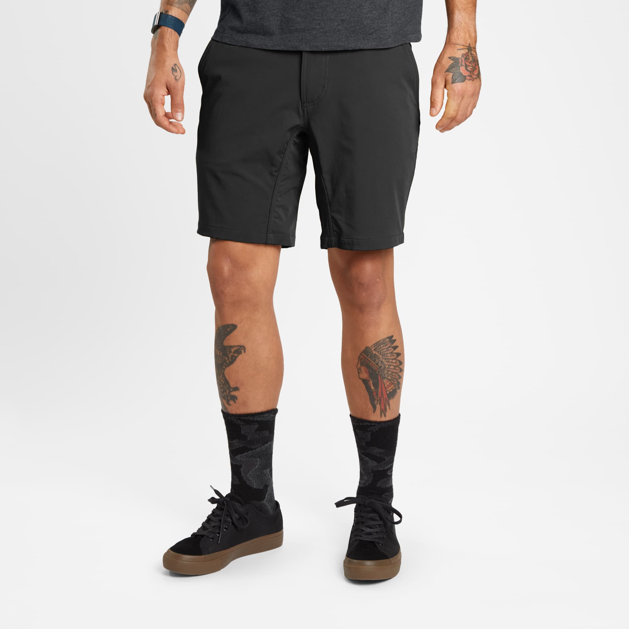 Men's 9" inseam Folsom Mid Short in black worn by a man #color_black