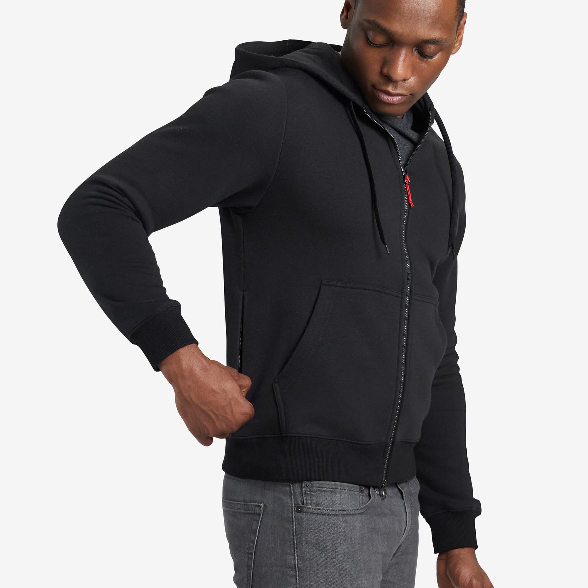 Black fleece Hoodie side zip detail on a man #color_black